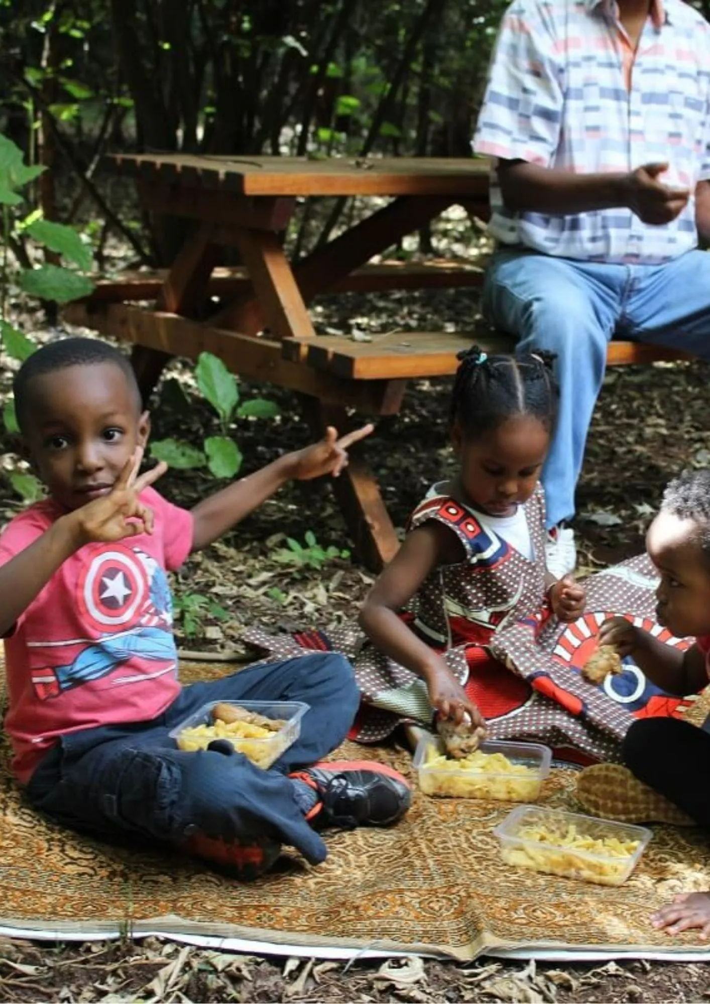 Family enjoying a picnic in the forest